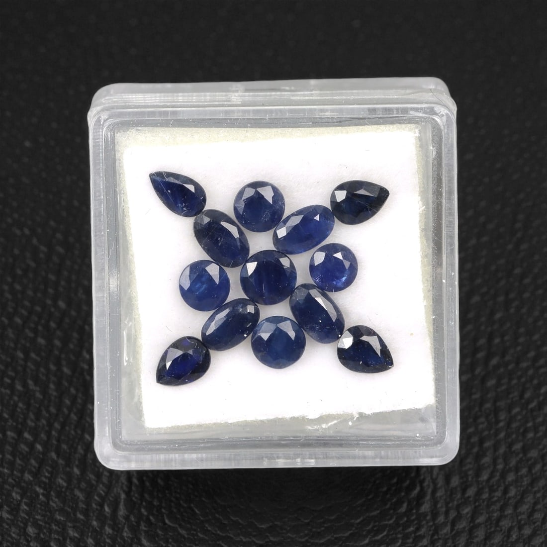 3.98 Carats Australian Blue Sapphire Parcel - Mixed Cut, 82DA: This curated parcel of mixed-cut blue sapphires from Australia exhibits a rich, deep blue hue, reminiscent of the ocean at midnight. The stones are precision-cut in a variety of shapes, including oval