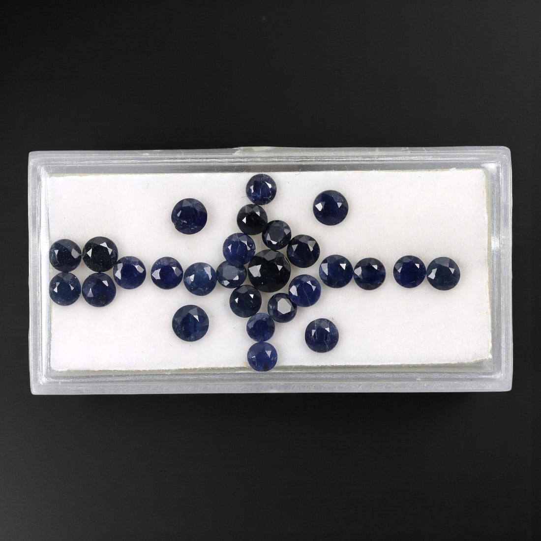 5.69 Carats Australian Blue Sapphire Parcel - Round Brilliant Cut, 57DA: This curated parcel of round brilliant-cut blue sapphires from Australia exhibits a rich, deep blue hue, reminiscent of the ocean at midnight. Each stone is precision-cut to maximize light return, cre