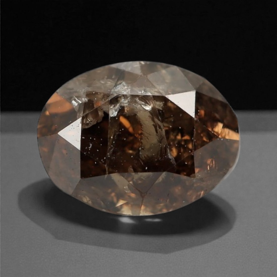 0.34 Carats Cognac Fancy Diamond - Natural African Stone, 4.5x3.4mm, 23A: This singular cognac fancy diamond radiates with a warm, ambered glow, evoking the rich tones of aged brandy and sunlit honey. Precision-cut in a classic brilliant shape, its facets catch light to rev
