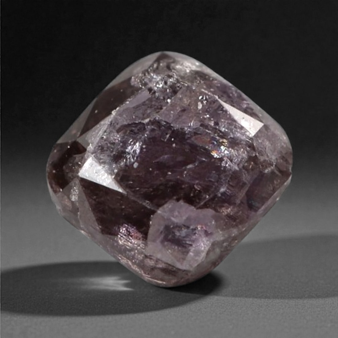 0.22 Carats Purplish Pink Diamond - Natural Argyle Mine, Australia, 97A: This singular purplish pink diamond from the Argyle mine is a rare and captivating gem, showcasing the distinctive, velvety hue that has made Australian pink diamonds among the most coveted in the wor