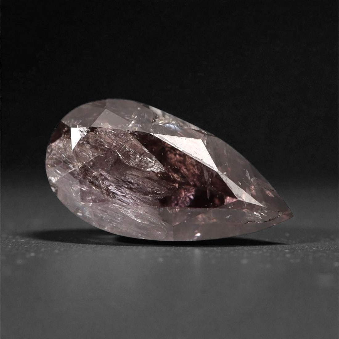 0.39 Carats Purplish Pink Diamond - Natural Argyle Mine, Australia, 88A: This singular purplish pink diamond from the Argyle mine is a rare and captivating gem, showcasing the distinctive, velvety hue that has made Australian pink diamonds among the most coveted in the wor