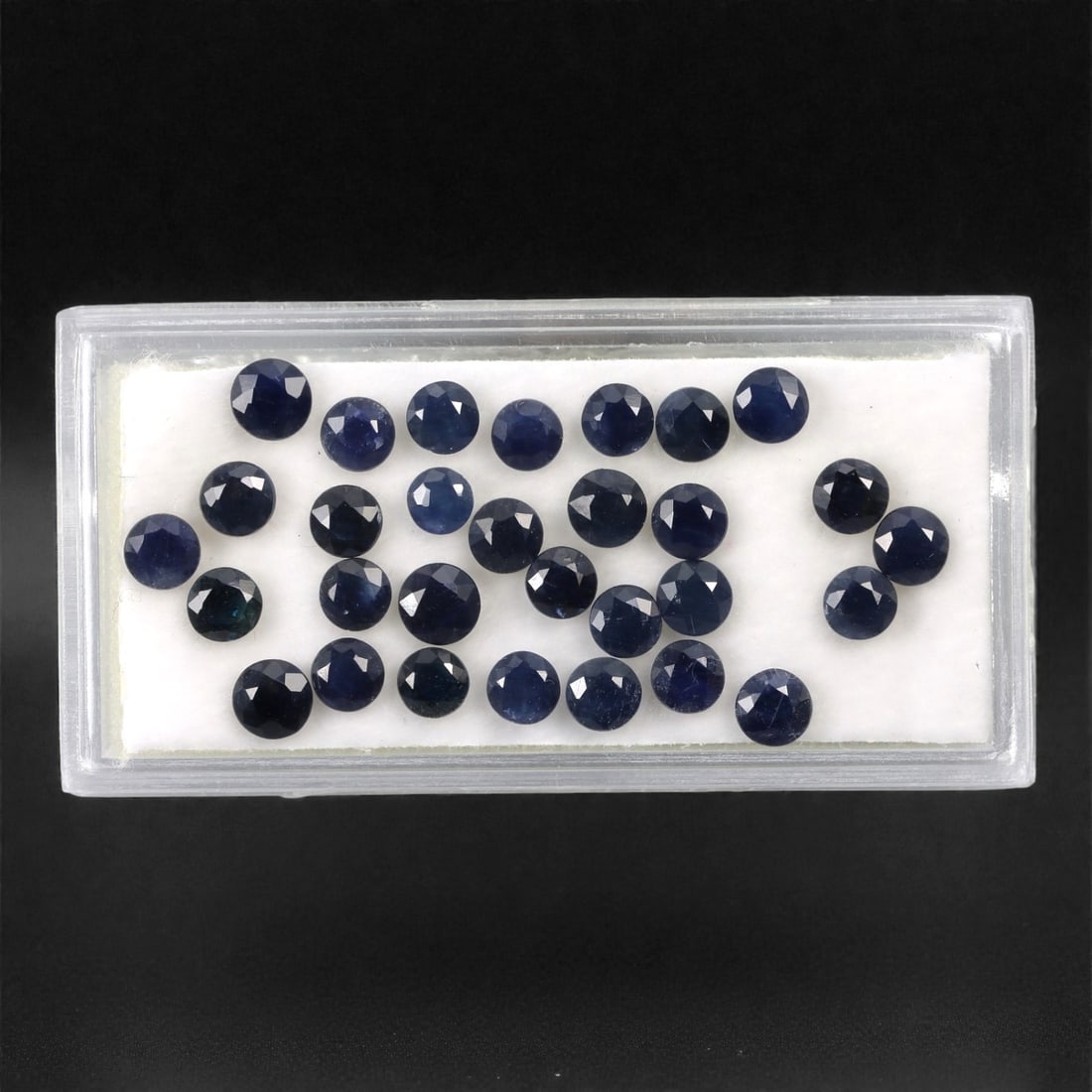 8.80 Carats Australian Blue Sapphire Parcel - Round Brilliant Cut, 71DA: This curated parcel of round brilliant-cut blue sapphires from Australia exhibits a rich, deep blue hue, reminiscent of the ocean at midnight. Each stone is precision-cut to maximize light return, cre