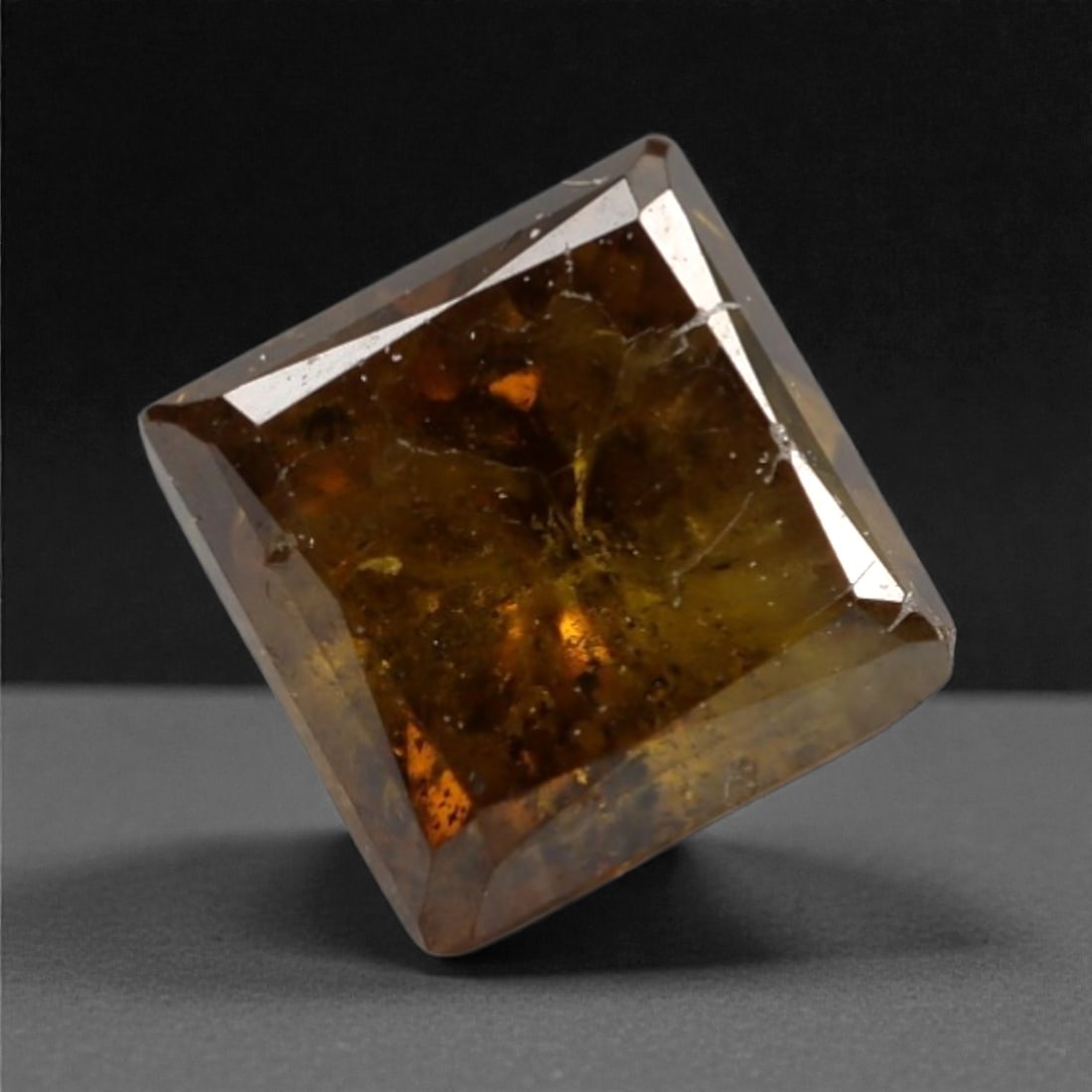 0.37 Carats Orangy Red Fancy Diamond - Princess Cut, 194A: This rare fancy orangy red diamond captivates with a vivid, warm hue that evokes the intensity of a glowing ember and the richness of a sunset. Cut in a well-proportioned princess shape, the stone's f