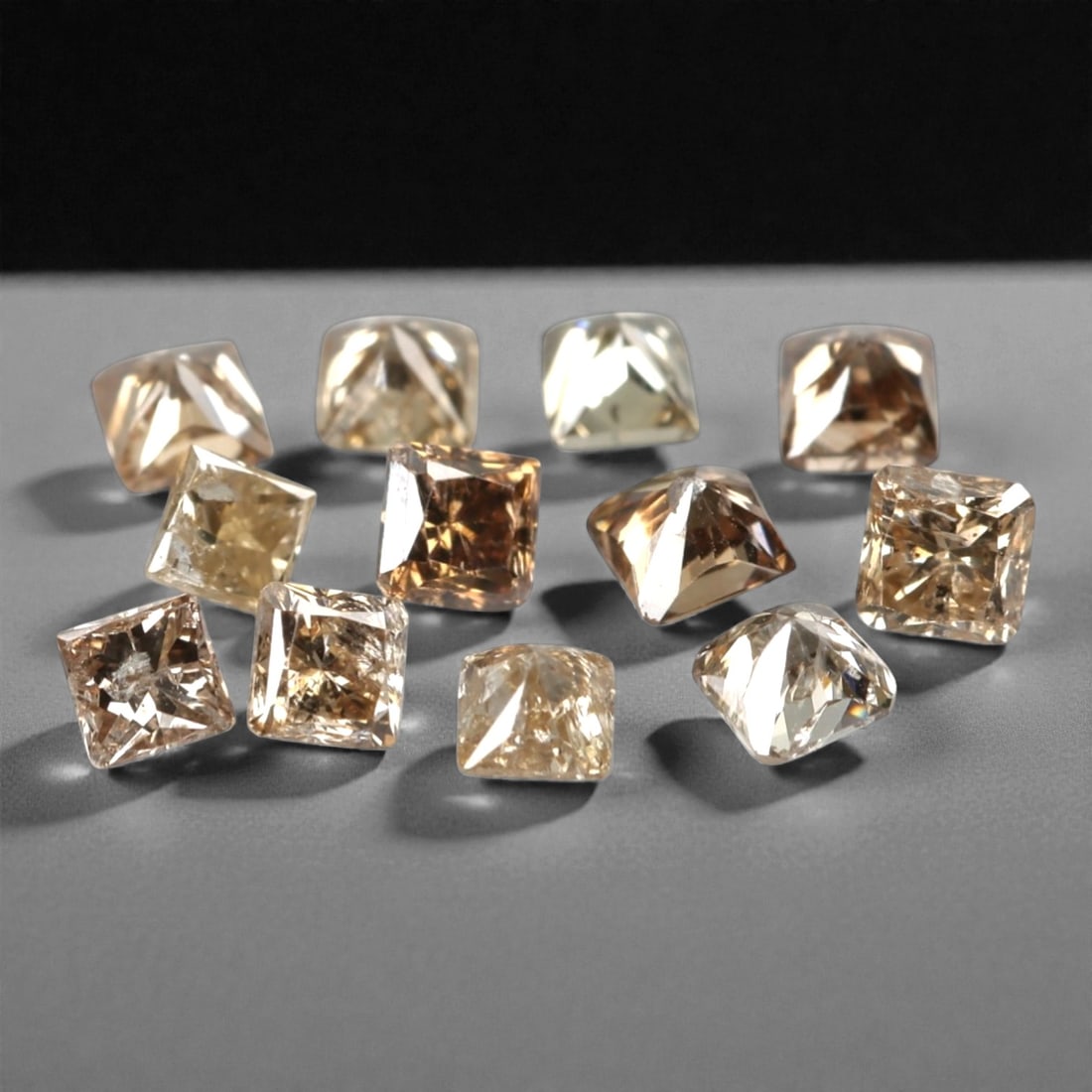 0.50ct 12 Pieces Champagne Diamond Parcel - Princess Cut, 204A: This elegant parcel of 12 loose champagne diamond gems captivates with a warm, honeyed hue that evokes the richness of aged champagne and the glow of liquid sunlight. Each stone is cut in a well-propo