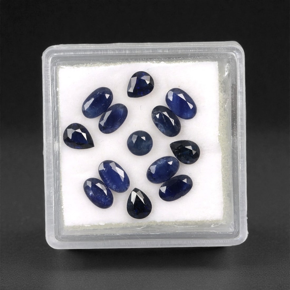 3.74 Carats Australian Blue Sapphire Parcel - Mixed Cut, 84DA: This curated parcel of mixed-cut blue sapphires from Australia exhibits a rich, deep blue hue, reminiscent of the ocean at midnight. The stones are precision-cut in a variety of shapes, including oval