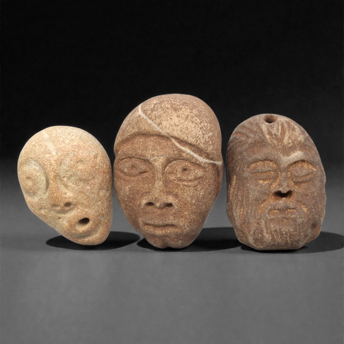 A Group of Three Medieval Stone Maskette Amulets, 10th-14th Century CE, 10ZH (1 of 1)
