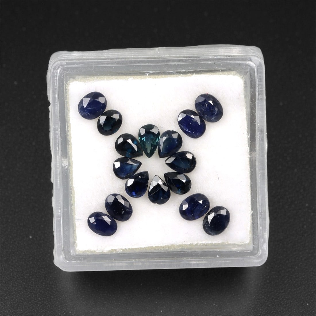 3.29 Carats Australian Blue Sapphire Parcel - Mixed Cut, 80DA: This curated parcel of mixed-cut blue sapphires from Australia exhibits a rich, deep blue hue, reminiscent of the ocean at midnight. The stones are precision-cut in a variety of shapes, including oval
