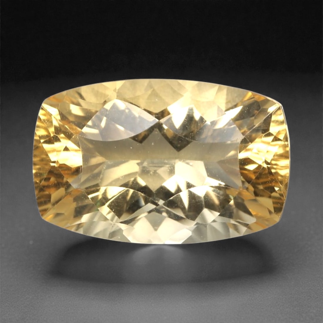 4.41 Carats Golden Yellow Citrine - Natural Brazilian Stone, 367A: This exceptional cushion-cut citrine gemstone captivates with a rich, honeyed golden-yellow hue, reminiscent of sunlit amber and liquid gold. The precision faceting maximizes light dispersion, creatin