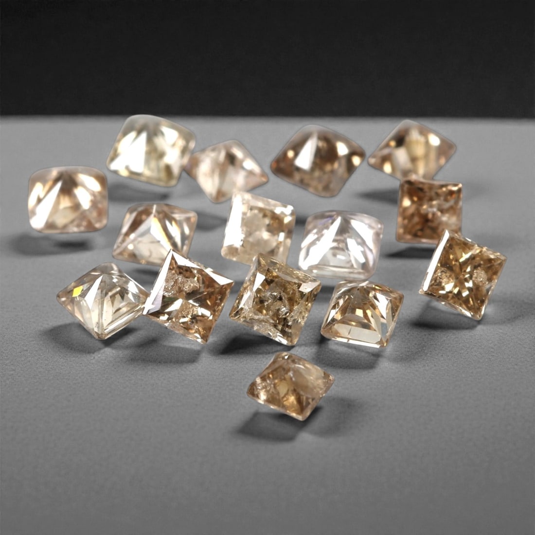 0.59ct 15 Pieces Champagne Diamond Parcel - Princess Cut, 201A: This elegant parcel of 15 loose champagne diamond gems captivates with a warm, honeyed hue that evokes the richness of aged champagne and the glow of liquid sunlight. Each stone is cut in a well-propo