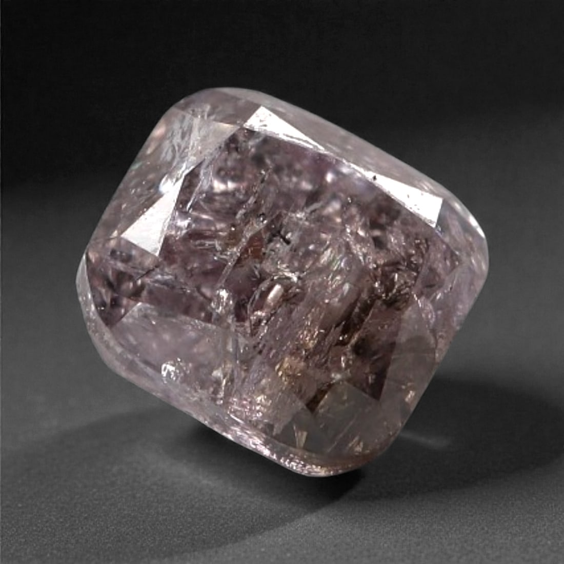 0.24 Carats Purplish Pink Diamond - Natural Argyle Mine, Australia, 86A: This singular purplish pink diamond from the Argyle mine is a rare and captivating gem, showcasing the distinctive, velvety hue that has made Australian pink diamonds among the most coveted in the wor