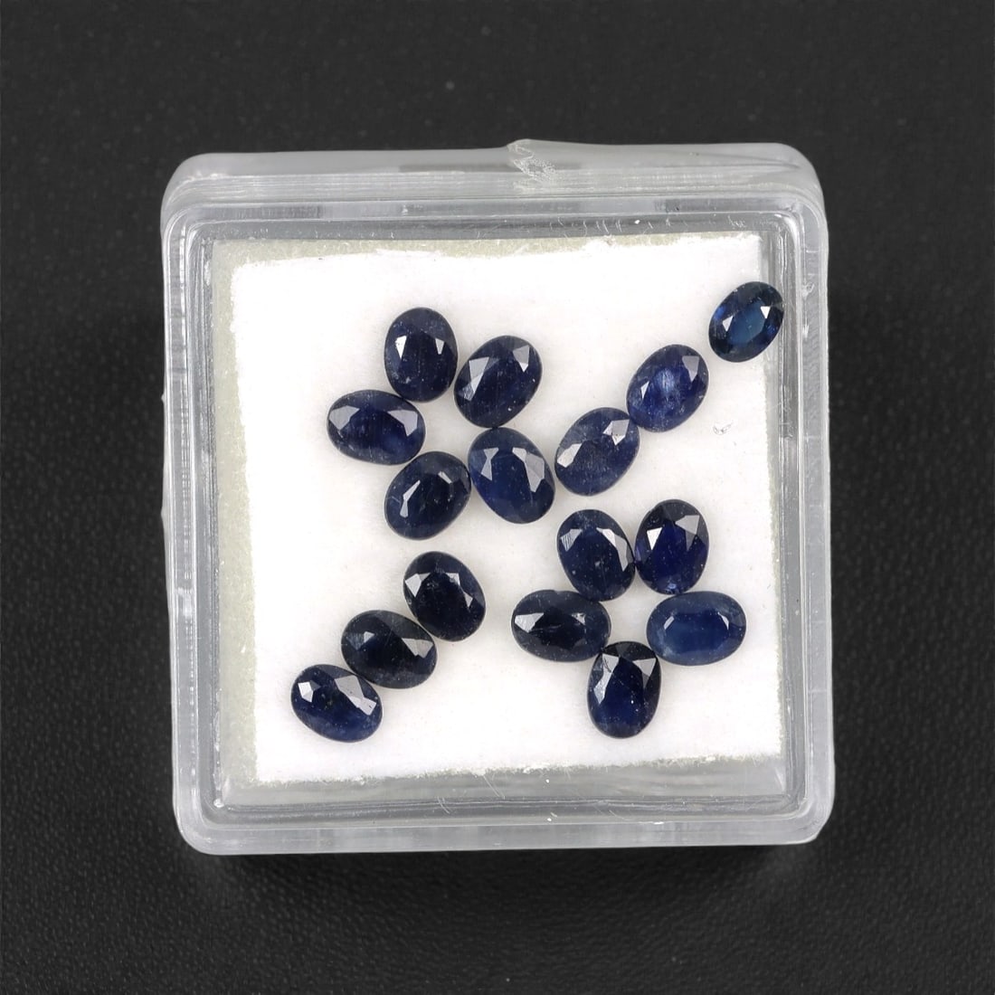 3.66 Carats Australian Blue Sapphire Parcel - Oval Cut, 73DA: This curated parcel of oval-cut blue sapphires from Australia exhibits a rich, deep blue hue, reminiscent of the ocean at midnight. Each stone is precision-cut to maximize light return, creating a spa
