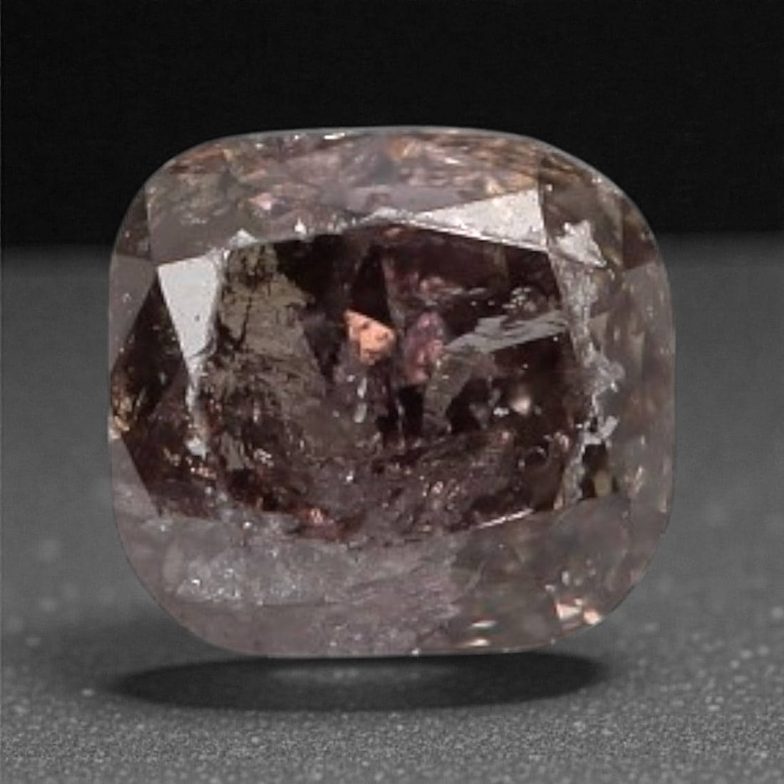 0.10 Carats Purplish Pink Diamond - Natural Argyle Mine, Australia, 81A: This singular purplish pink diamond from the Argyle mine is a rare and captivating gem, showcasing the distinctive, velvety hue that has made Australian pink diamonds among the most coveted in the wor
