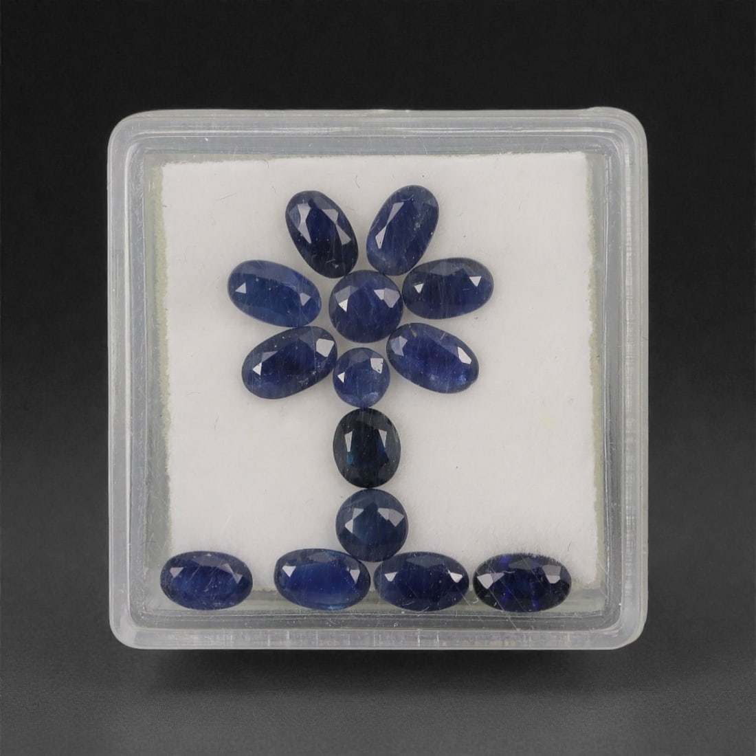 3.88 Carats Oval-Cut Deep Blue Australian Sapphire Parcel - Natural Australian Stones, 4XL: This curated parcel of Australian sapphires features a rich palette of deep, velvety blue tones, with each oval-cut stone exhibiting a classic, saturated hue. The oval faceting enhances the stones' br