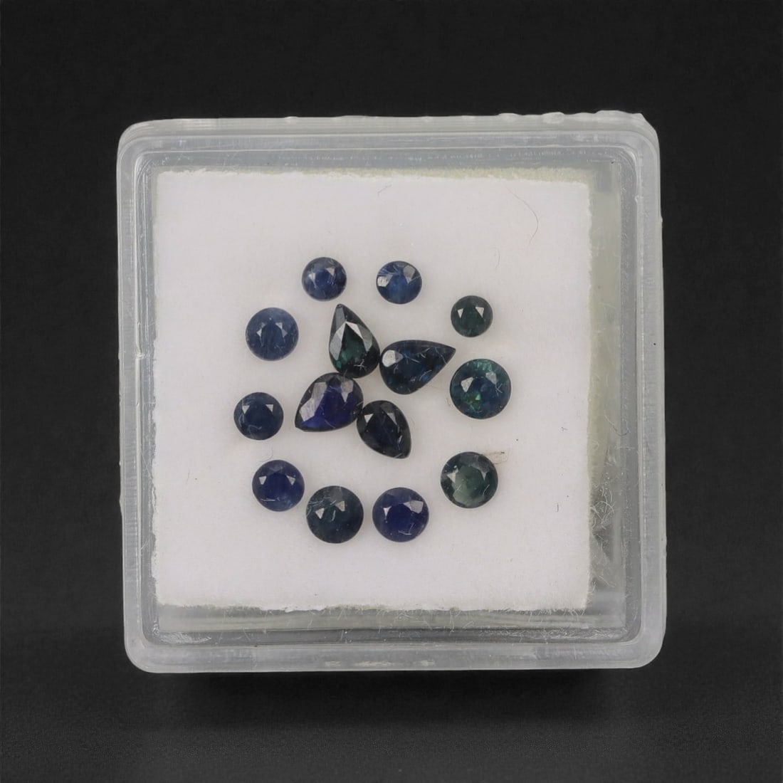 1.67 Carats Deep Royal Blue Sapphire Parcel - Natural Australian Stones, 59XL: This curated parcel of 1.67 carats of loose sapphires captivates with a spectrum of deep royal blue hues, ranging from velvety midnight tones to vivid, saturated shades that catch the light with every