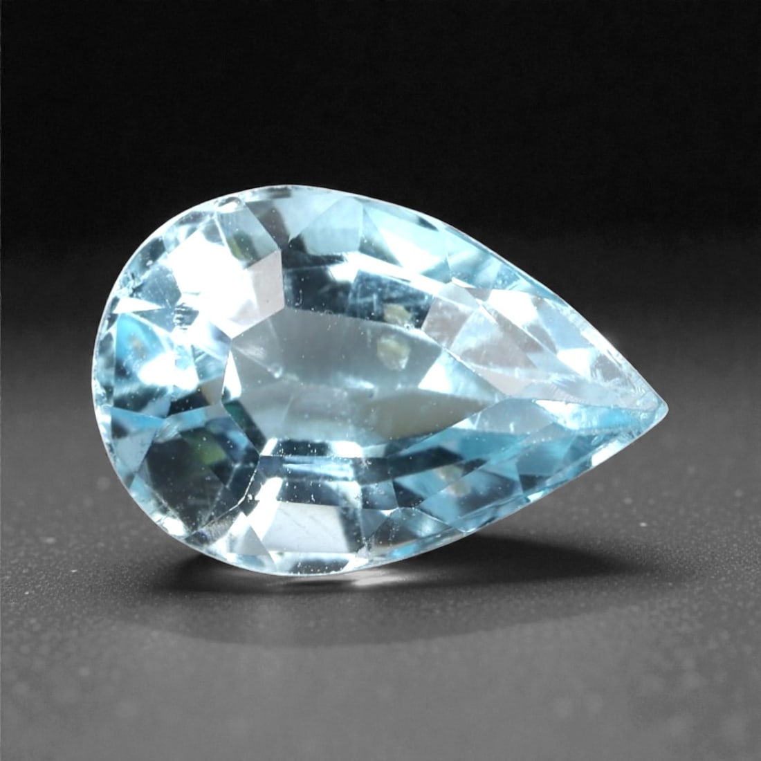 3.03 Carats Sky Blue Topaz Pear - Natural Brazilian Stone, 357A: This luminous sky blue topaz gem captivates with a soft, icy blue hue that evokes the clarity of a bright winter sky and the tranquility of glacial waters. Cut in a well-proportioned pear shape, the s
