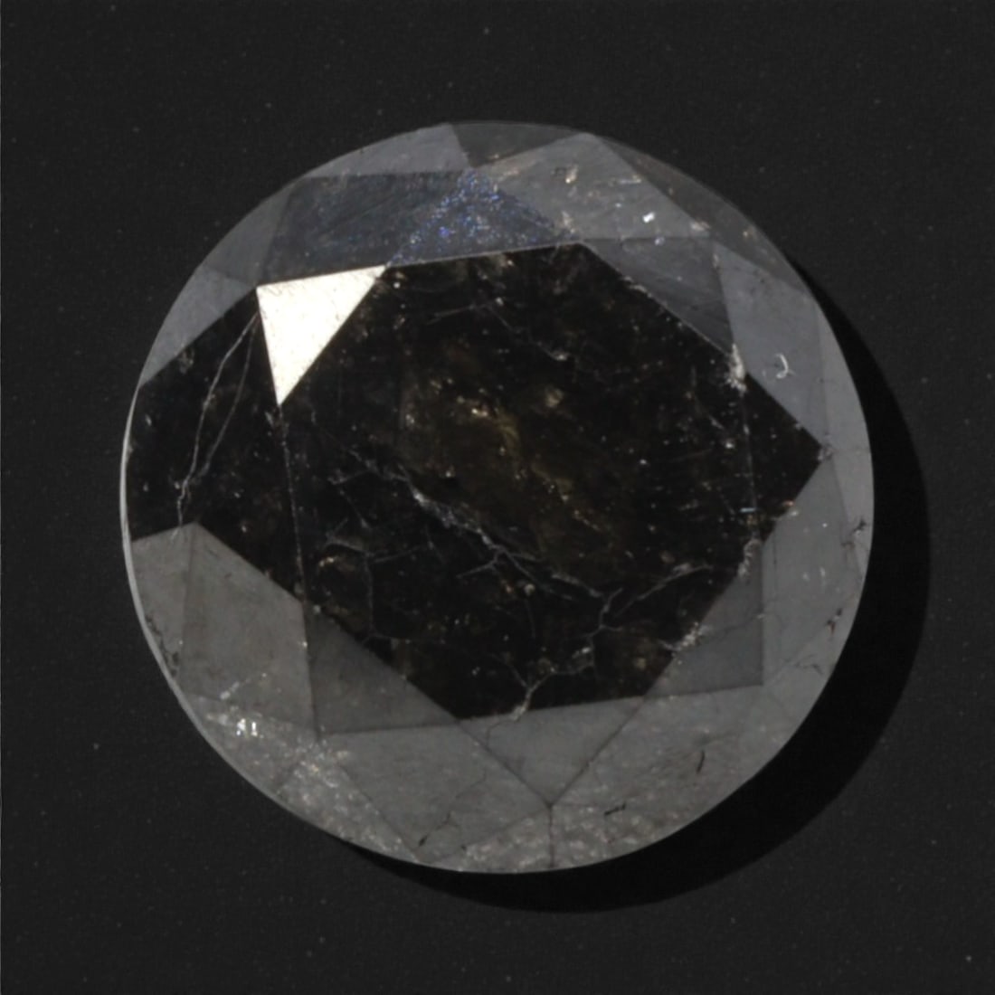 2.33 Carats Black Diamond - Round Brilliant Cut, 285A: This substantial black diamond captivates with a deep, opaque black hue that evokes the intensity of polished obsidian and the mystery of a midnight sky. Cut in a well-proportioned round brilliant sha