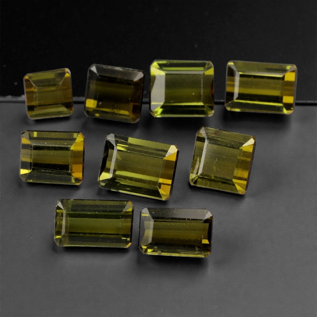 8.02 Carats Yellow-Green Tourmaline Parcel - Natural Nigerian Stones, 4-6mm, 3XK: This luminous parcel of emerald-cut tourmalines glows in a refined spectrum of yellow-green tones, ranging from golden olive to chartreuse. The precision faceting brings out a vibrant inner radiance,