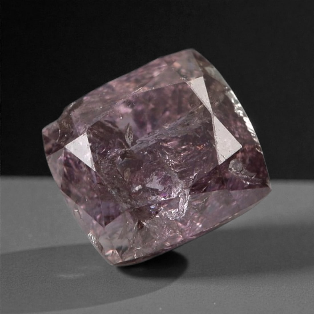 0.32 Carats Purplish Pink Diamond - Natural Argyle Mine, Australia, 111A: This singular purplish pink diamond from the Argyle mine is a rare and captivating gem, showcasing the distinctive, velvety hue that has made Australian pink diamonds among the most coveted in the wor