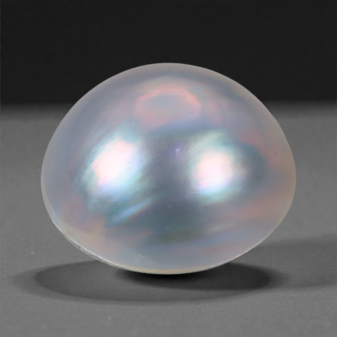 7.19 Carats Silvery Rose Baroque Pearl - Natural Cultured Gem - 14 mm, 30WE: This captivating baroque pearl shimmers with a silvery body color suffused with elegant rose, violet, and soft aqua overtones. Its surface exhibits high luster and excellent nacre, creating a smooth g