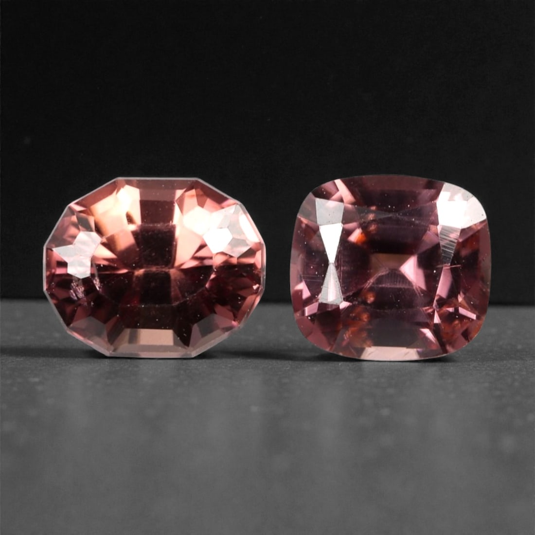 3.21 Carats Pinkish Brown Zircon Parcel - Natural Sri Lankan Stones, 353A: This striking parcel of two loose zircon gems captivates with a warm, pinkish-brown hue that evokes the richness of aged rosewood and the glow of a setting sun. Each stone is cut in a distinctive, wel