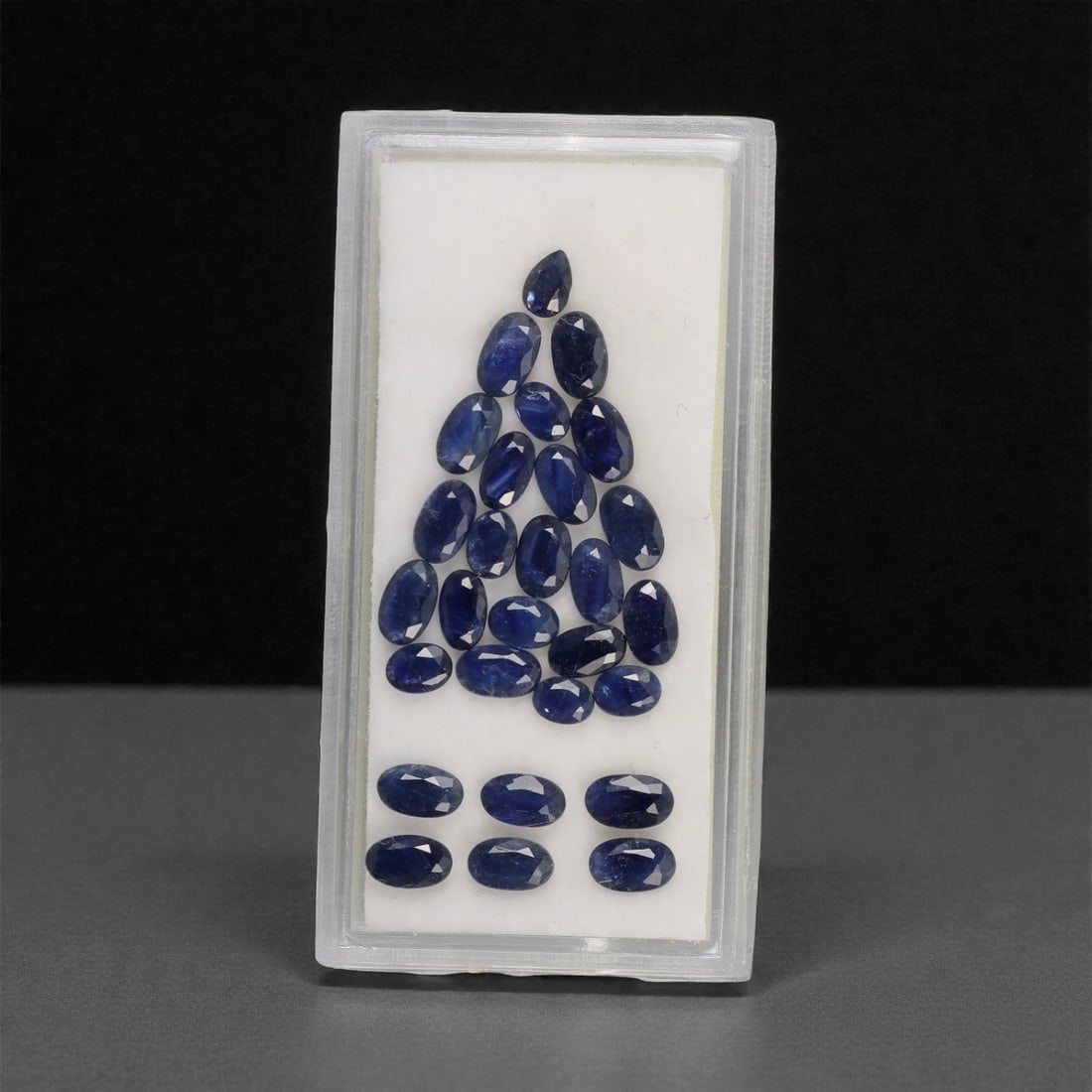7.04 Carats Deep Blue Sapphire Parcel - Natural Australian Stones, 99DA: This substantial 7.04 carat parcel of Australian sapphires presents a rich, cohesive palette of deep, velvety blues, ranging from intense midnight tones to softer, slightly lighter blue undertones. Ea