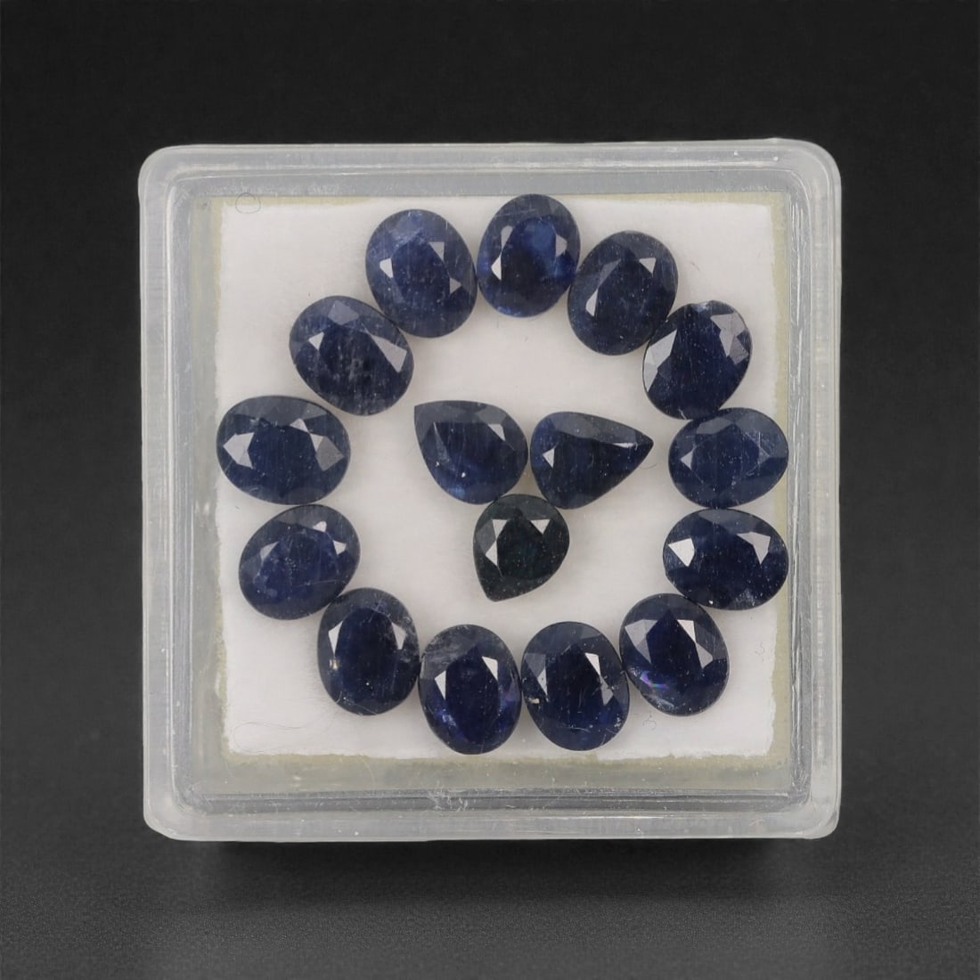 7.17 Carats Deep Royal Blue Sapphire Parcel - Natural Australian Stones, 33XL: This refined parcel of 7.17 carats of loose sapphires captivates with a spectrum of deep royal blue hues, ranging from velvety midnight tones to vivid, saturated shades that catch the light with every