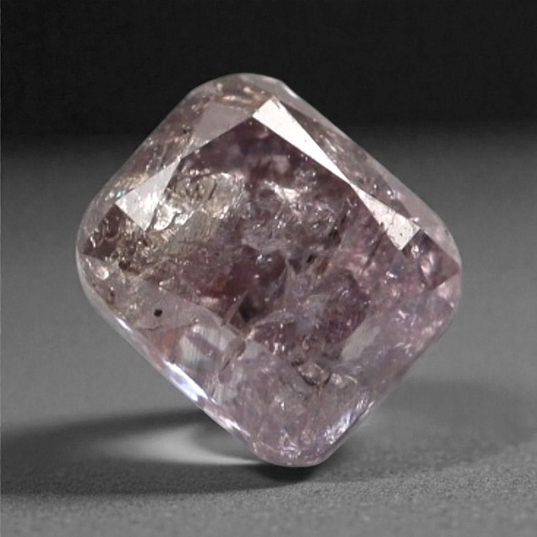 0.16 Carats Purplish Pink Diamond - Natural Argyle Mine, Australia, 107A: This singular purplish pink diamond from the Argyle mine is a rare and captivating gem, showcasing the distinctive, velvety hue that has made Australian pink diamonds among the most coveted in the wor