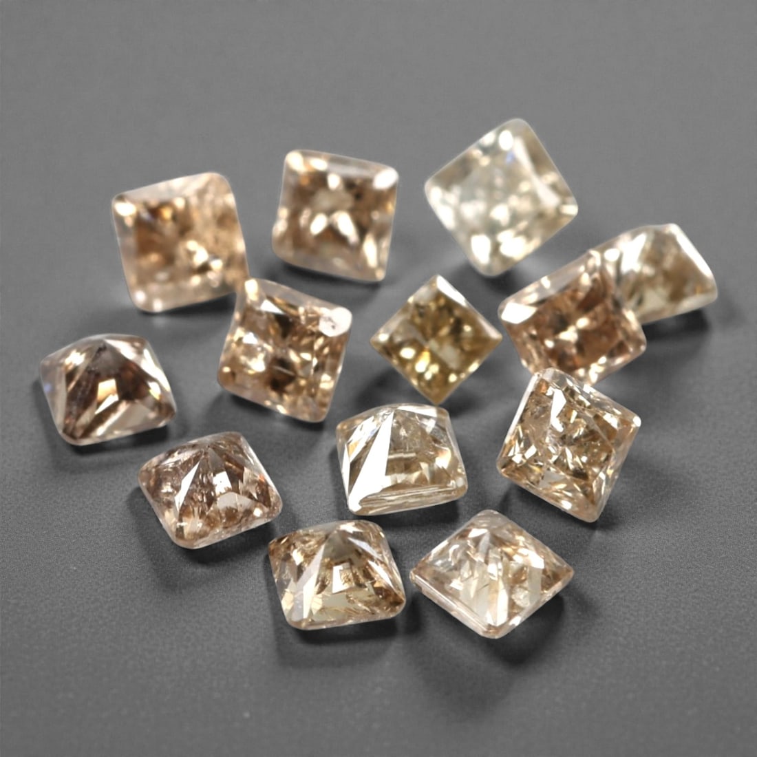 0.59ct 13 Pieces Champagne Diamond Parcel - Princess Cut, 213A: This elegant parcel of 13 loose champagne diamond gems captivates with a warm, honeyed hue that evokes the richness of aged champagne and the glow of liquid sunlight. Each stone is cut in a well-propo