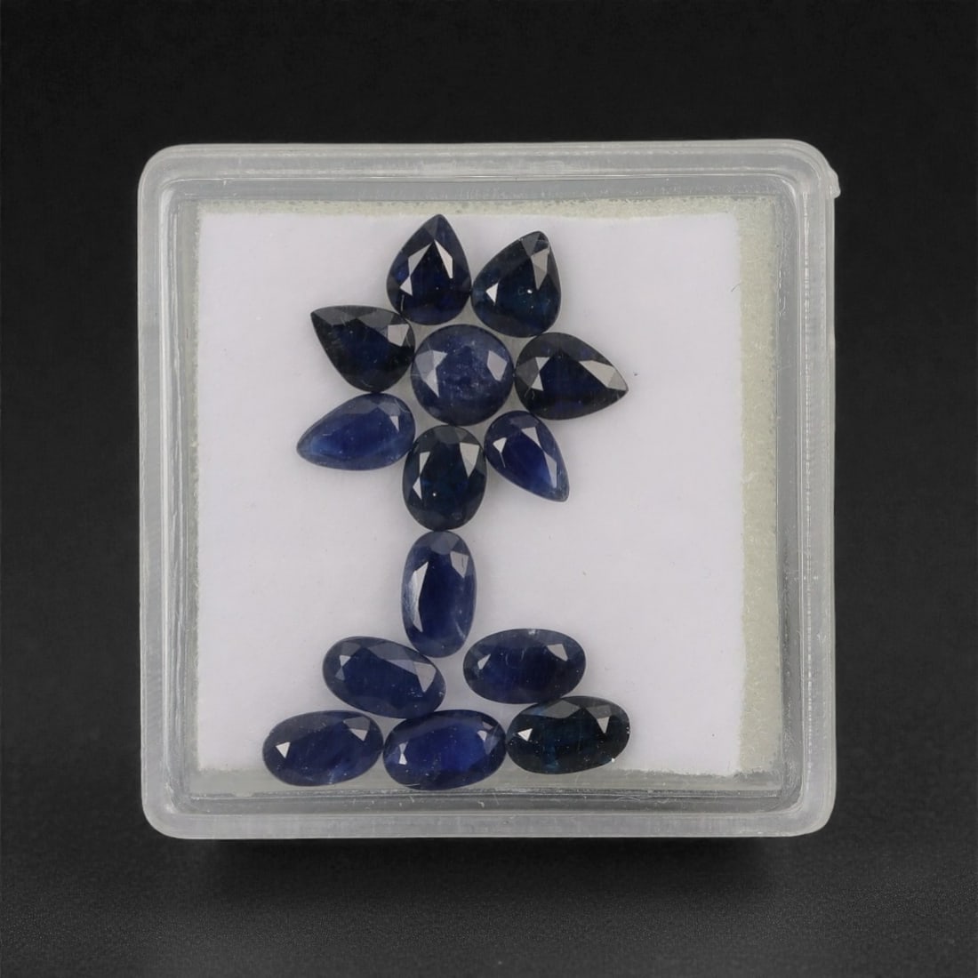 4.09 Carats Mixed-Cut Australian Sapphire Parcel - Natural Australian Stones, 7XL: This curated parcel of Australian sapphires features a rich palette of deep blue tones, with a mix of pear, oval, and round cuts. The varied shapes offer exceptional design versatility, while the clas