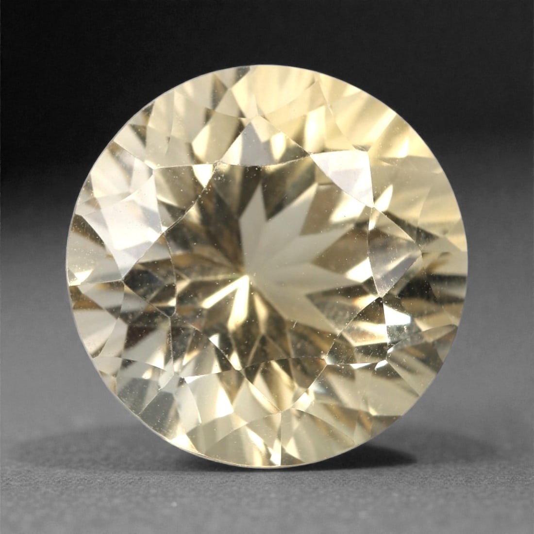 5.22 Carats Pale Yellow Citrine Round - Natural Brazilian Stone, 333A: This luminous pale yellow citrine gem captivates with a warm, honeyed hue that evokes the glow of liquid sunlight and the richness of aged amber. Cut in a well-proportioned round brilliant shape, the