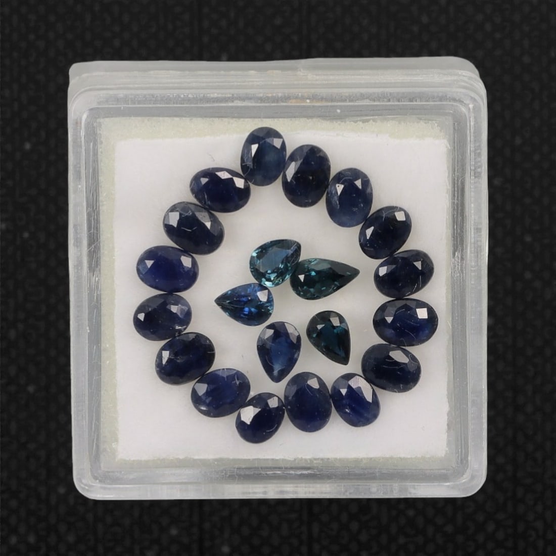 4.91 Carats Australian Blue Sapphire Parcel - Natural Australian Stones, 1DB: This curated 4.91 carat parcel of Australian blue sapphires captivates with a spectrum of deep, velvety blues, ranging from rich midnight tones to vivid teal and aqua undertones. Each stone is precisi