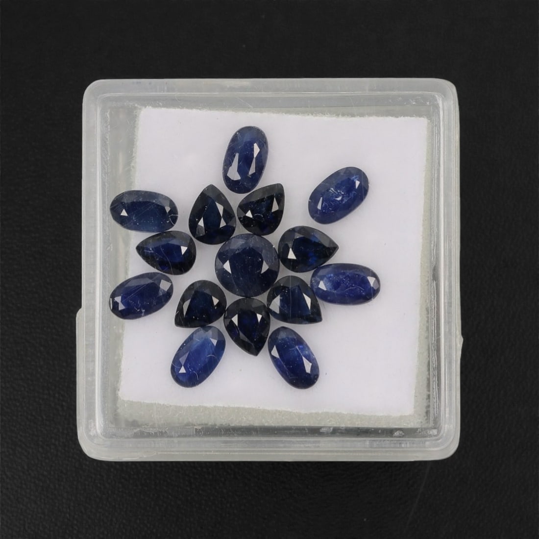 4.35 Carats Mixed-Cut Deep Blue Australian Sapphire Parcel - Natural Australian Stones, 3XL: This curated parcel of Australian sapphires features a rich palette of deep, velvety blue tones, with a mix of oval, pear, and round cuts. The varied shapes offer exceptional design versatility, while