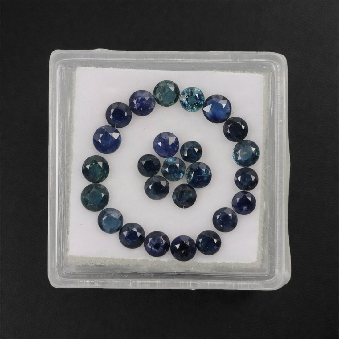 3.52 Carats Teal-Blue Parti Sapphire Parcel - Natural Australian Stones, 28XL: This curated parcel of parti sapphires presents a striking blend of deep teal, forest green, and vivid blue tones, with dynamic color zoning that shifts and glows under changing light. Each round, fac
