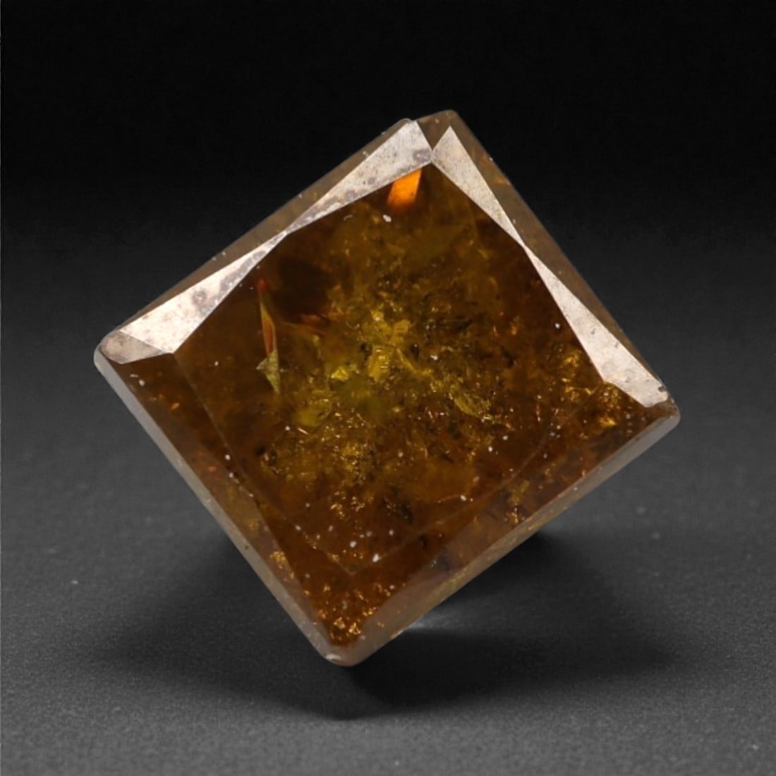 0.40 Carats Orangy Red Fancy Diamond - Princess Cut, 188A: This rare fancy orangy red diamond captivates with a vivid, warm hue that evokes the intensity of a glowing ember and the richness of a sunset. Cut in a well-proportioned princess shape, the stone's f