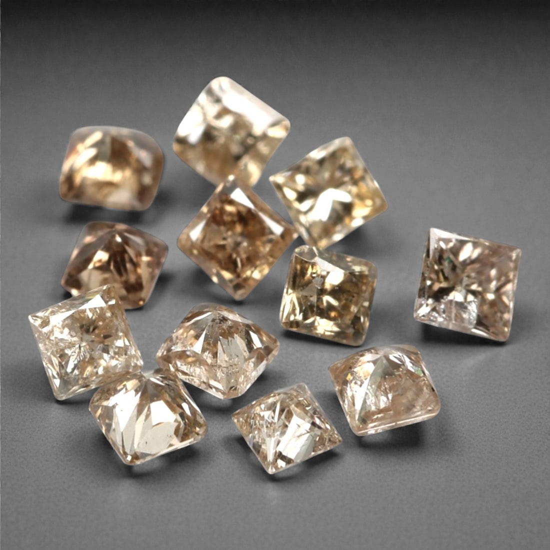 0.57ct 12 Pieces Champagne Diamond Parcel - Princess Cut, 212A: This elegant parcel of 12 loose champagne diamond gems captivates with a warm, honeyed hue that evokes the richness of aged champagne and the glow of liquid sunlight. Each stone is cut in a well-propo
