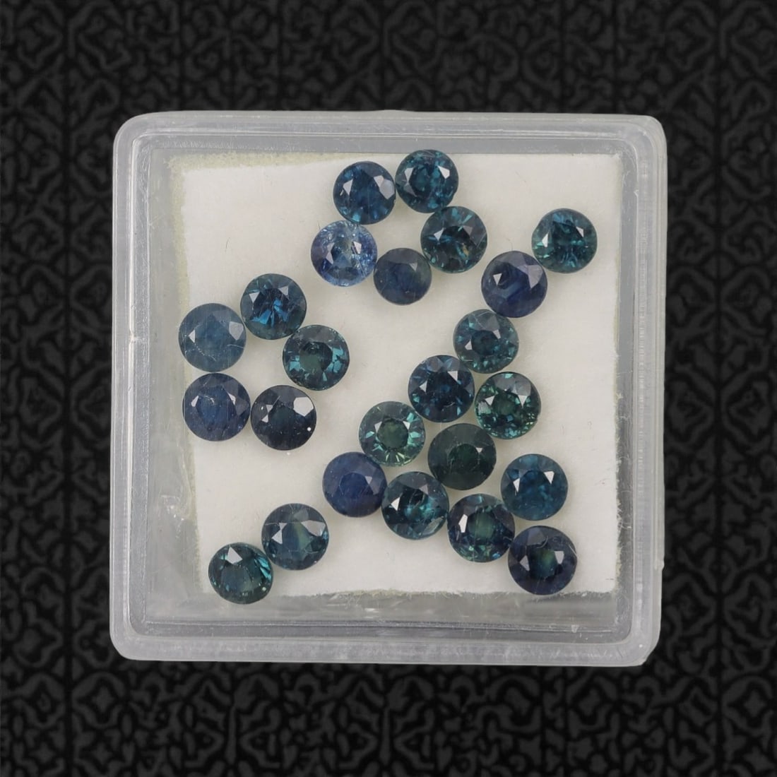 5.46 Carats Multitone Parti Sapphire Parcel - Natural Australian Stones, 23XL: This substantial parcel of parti sapphires dazzles with a rich spectrum of deep teal, forest green, and moody blue tones, each round, faceted stone showcasing dynamic color zoning that shifts and glow