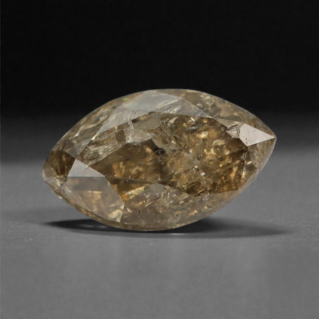 0.27 Carats Cognac Fancy Diamond - Natural African Stone, 5.4x3.2mm, 35A: This singular cognac fancy diamond radiates with a warm, ambered glow, evoking the rich tones of aged brandy and sunlit honey. Precision-cut in a classic brilliant shape, its facets catch light to rev