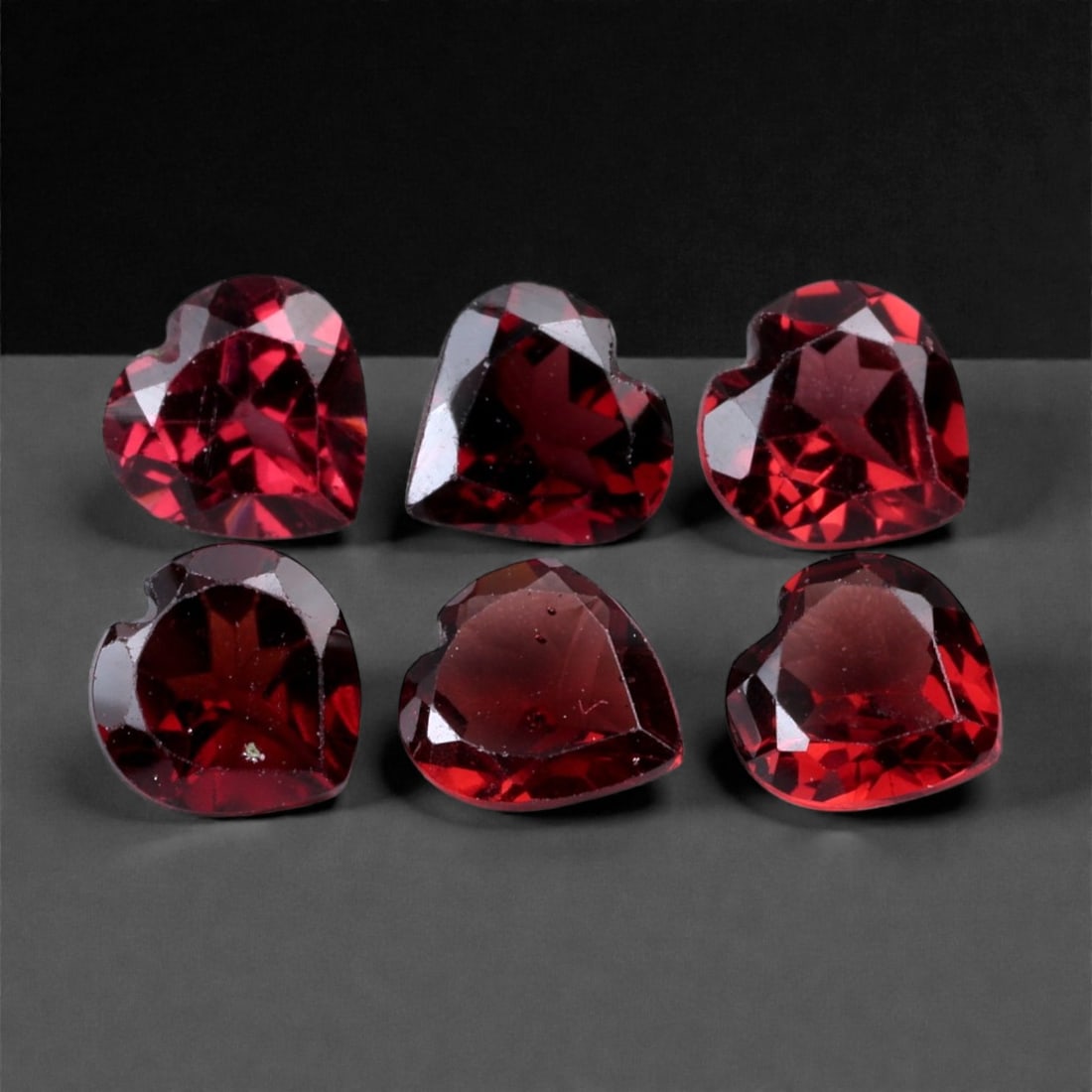 5.29 Carats Deep Crimson Garnet Parcel - Natural Mozambique Stones, 5.8-6mm, 95XH: This richly saturated parcel of heart-shaped garnets glows with a bold crimson red hue, enhanced by excellent faceting and internal clarity. Each gem radiates a deep wine-like tone, catching flashes o