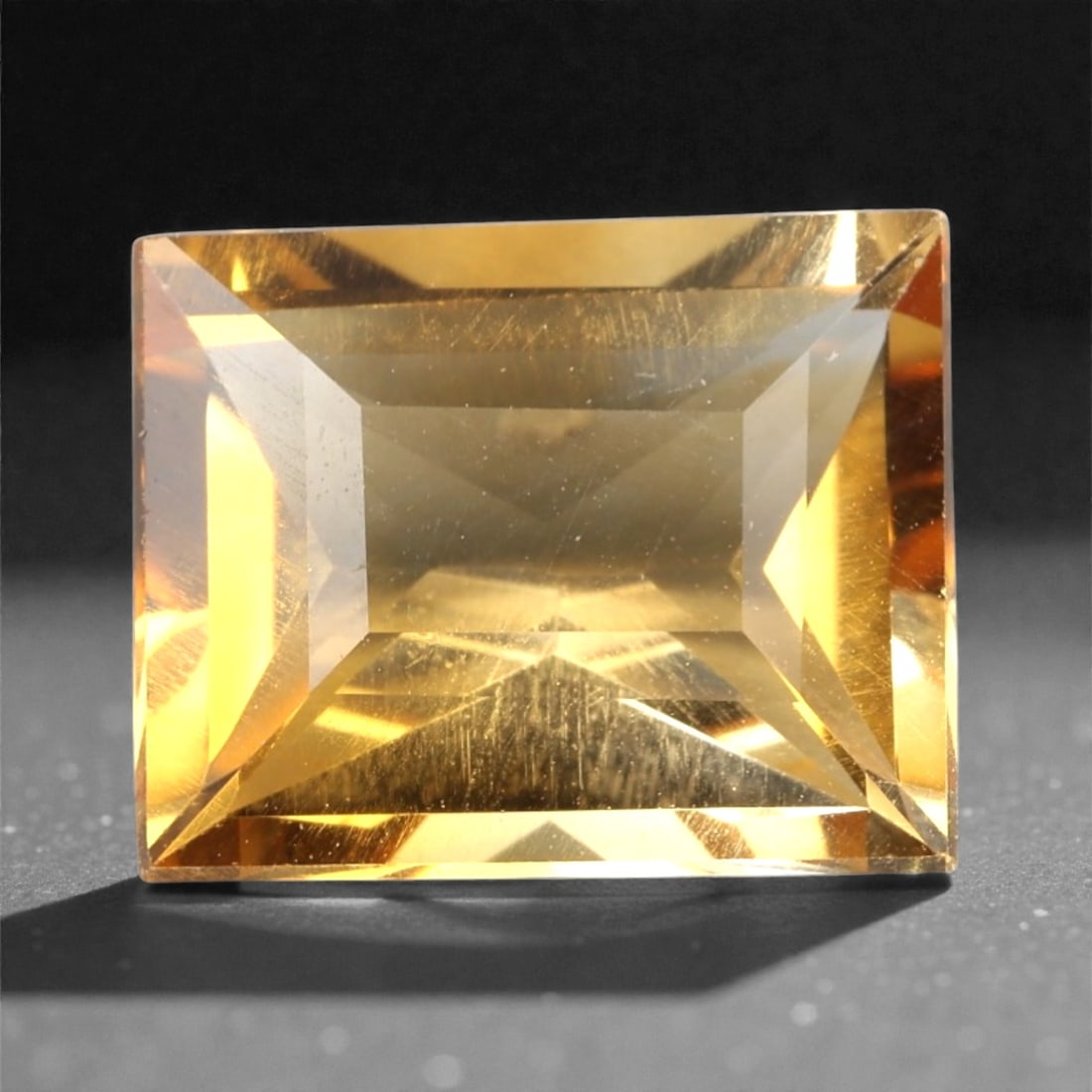 3.78 Carats Rich Golden Citrine Rectangular - Natural Brazilian Stone, 360A: This rich golden citrine gem captivates with a warm, honeyed hue that evokes the glow of liquid sunlight and the richness of aged amber. Cut in a well-proportioned rectangular shape, the stone's facet