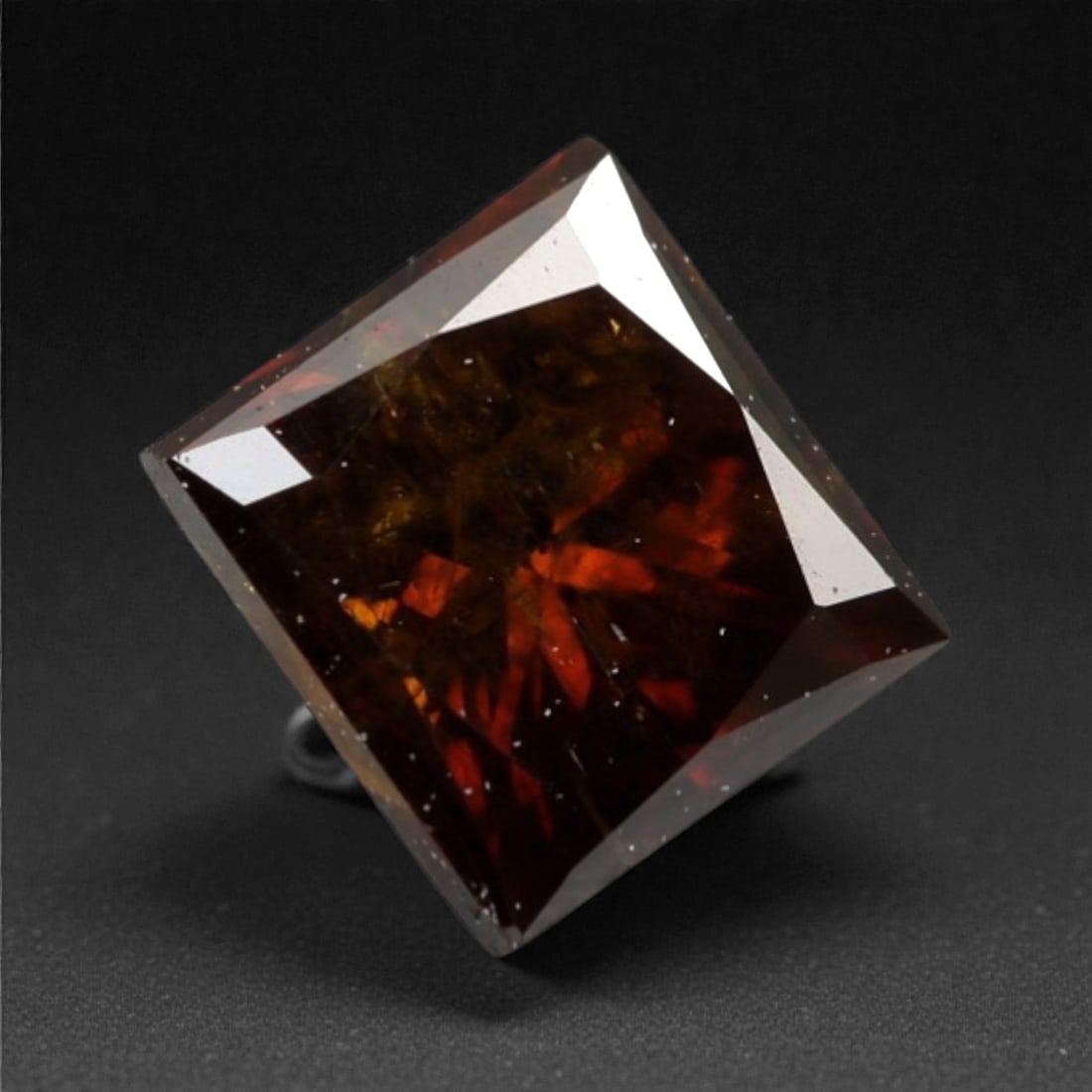 0.36 Carats Orangy Red Fancy Diamond - Princess Cut, 184A: This rare fancy orangy red diamond captivates with a vivid, warm hue that evokes the intensity of a glowing ember and the richness of a sunset. Cut in a well-proportioned princess shape, the stone's f