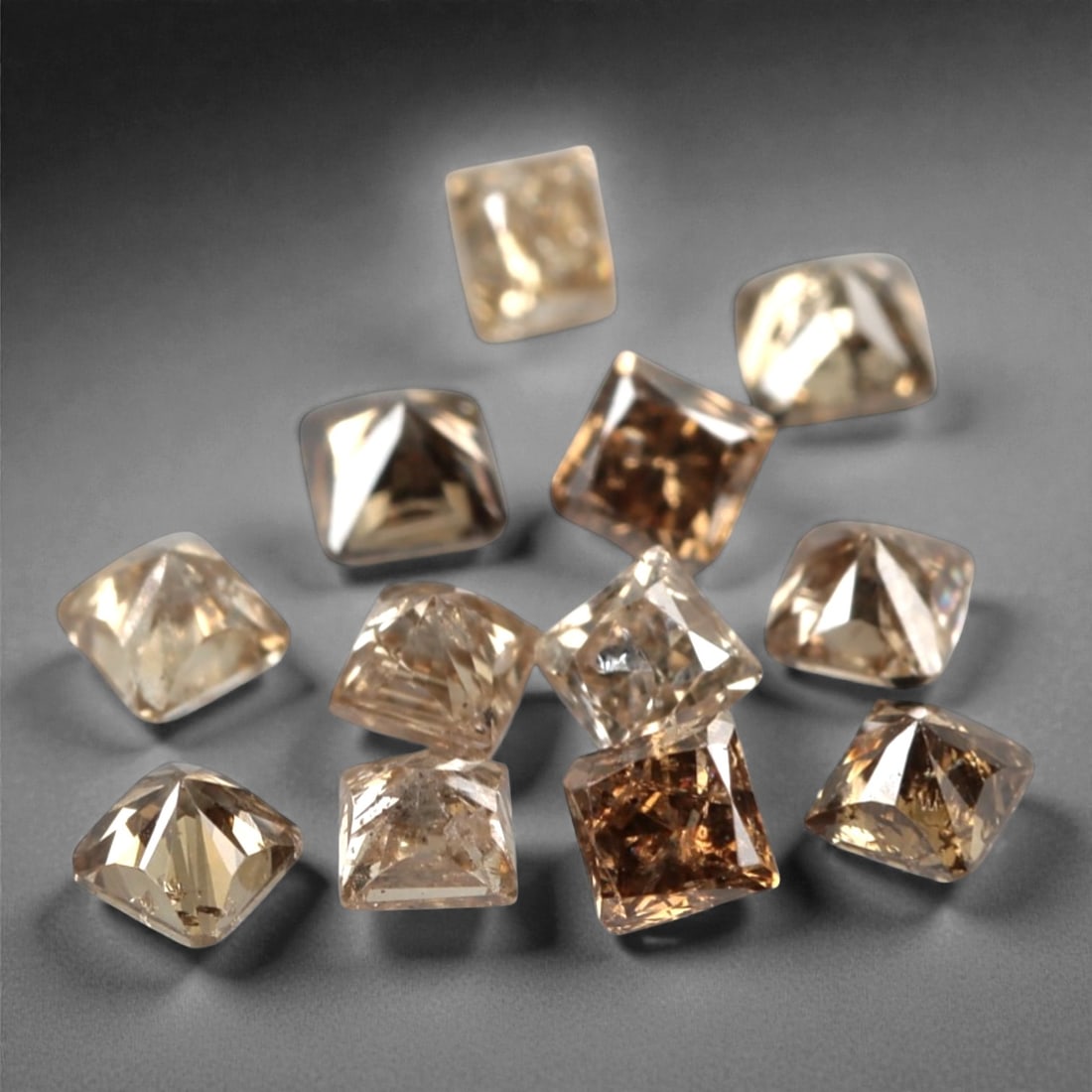 12 Pieces Champagne Diamond Parcel - Princess Cut, 0.57ct, 210A: This elegant parcel of 12 loose champagne diamond gems captivates with a warm, honeyed hue that evokes the richness of aged champagne and the glow of liquid sunlight. Each stone is cut in a well-propo