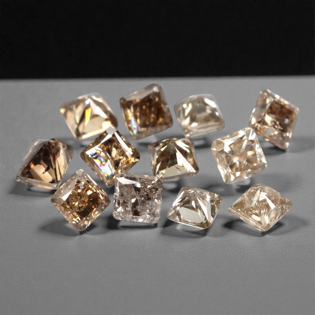 12 Pieces Champagne Diamond Parcel - Princess Cut, 0.56ct, 214A: This elegant parcel of 12 loose champagne diamond gems captivates with a warm, honeyed hue that evokes the richness of aged champagne and the glow of liquid sunlight. Each stone is cut in a well-propo