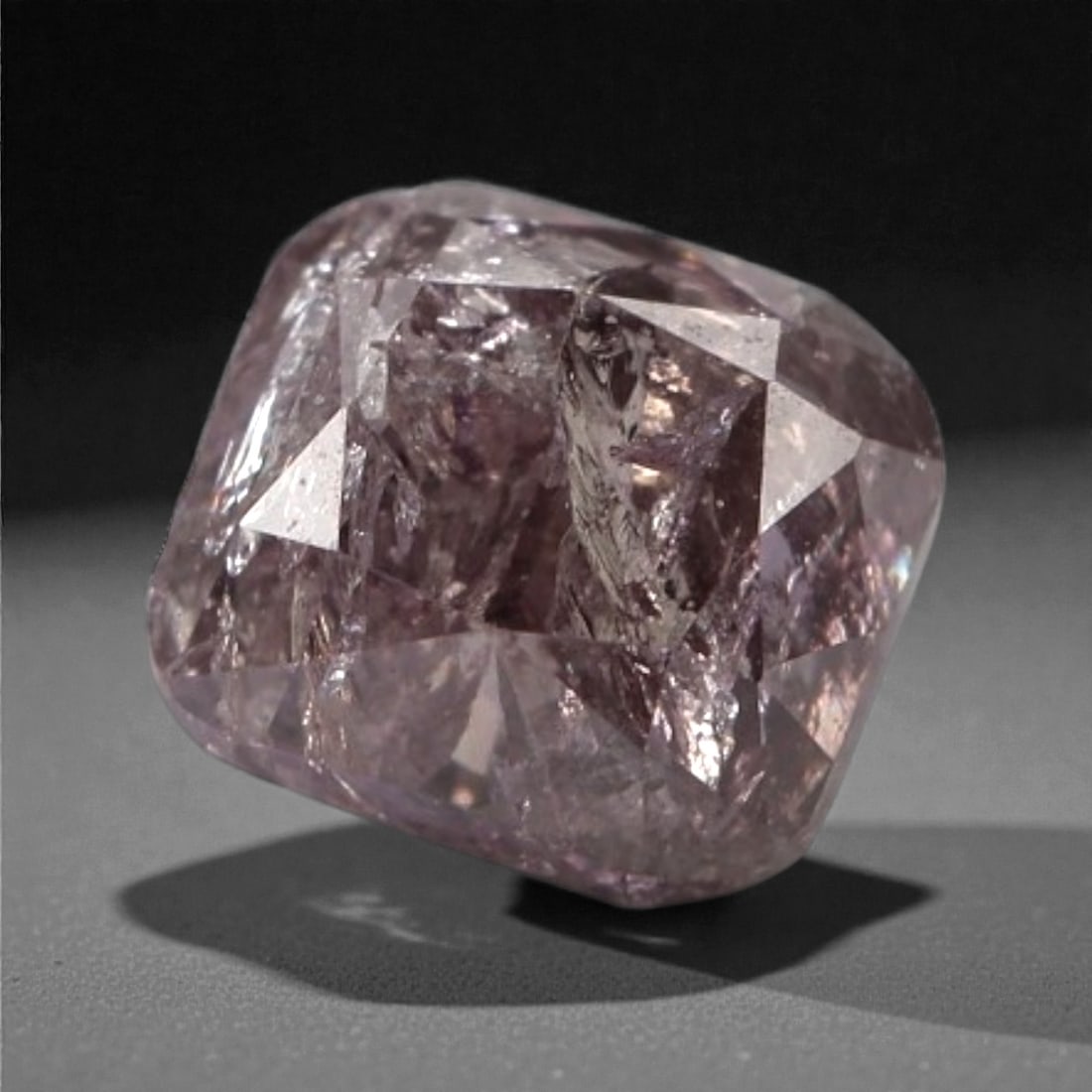 0.27 Carats Purplish Pink Diamond - Natural Argyle Mine, Australia, 93A: This singular purplish pink diamond from the Argyle mine is a rare and captivating gem, showcasing the distinctive, velvety hue that has made Australian pink diamonds among the most coveted in the wor