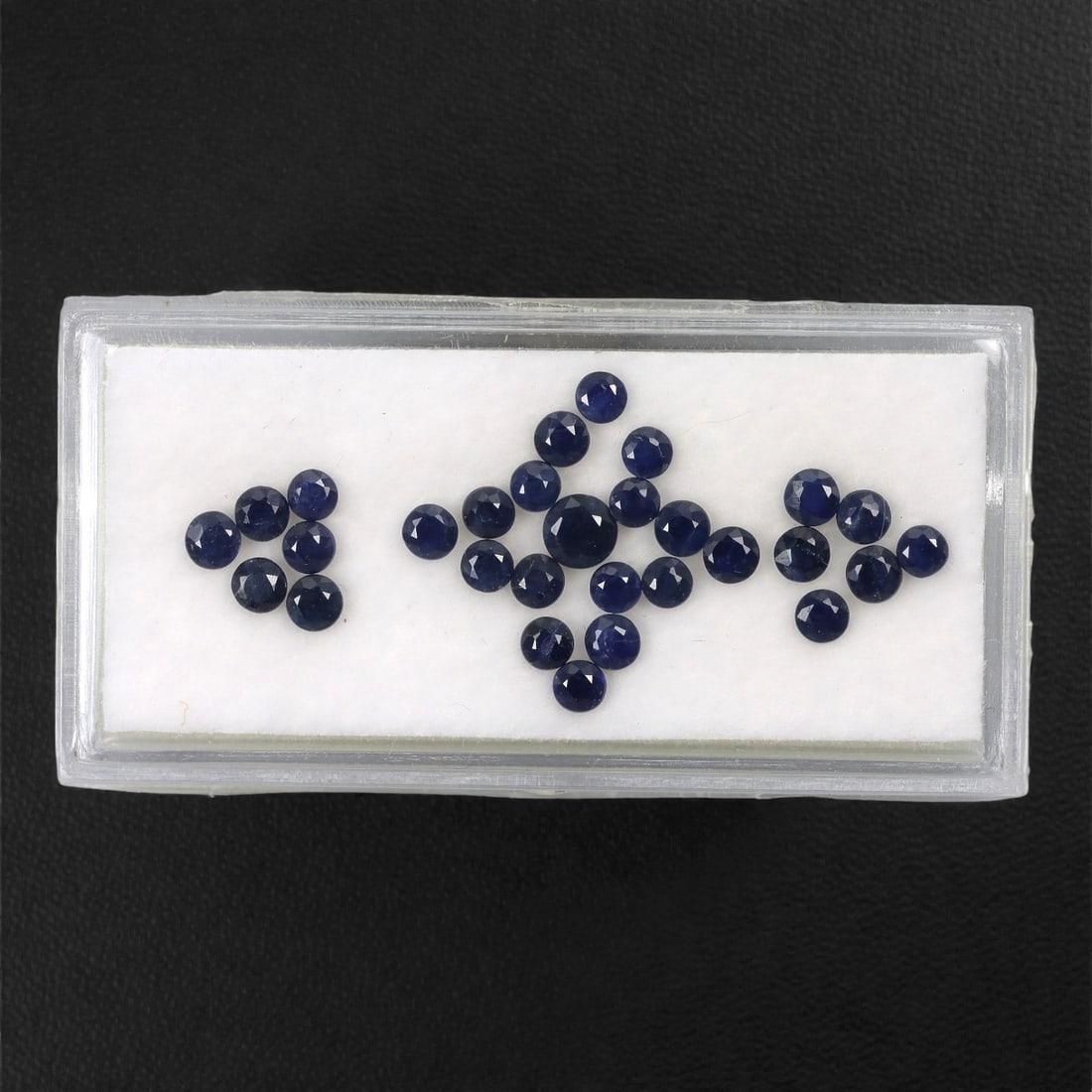 3.60 Carats Australian Blue Sapphire Parcel - Round Brilliant Cut, 69DA: This curated parcel of round brilliant-cut blue sapphires from Australia exhibits a rich, deep blue hue, reminiscent of the ocean at midnight. Each stone is precision-cut to maximize light return, cre