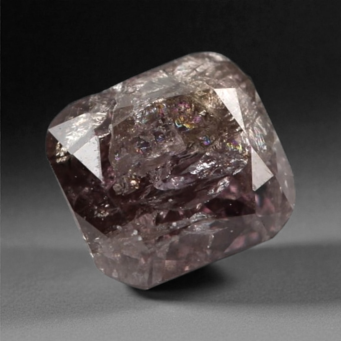 0.27 Carats Purplish Pink Diamond - Natural Argyle Mine, Australia, 103A: This singular purplish pink diamond from the Argyle mine is a rare and captivating gem, showcasing the distinctive, velvety hue that has made Australian pink diamonds among the most coveted in the wor
