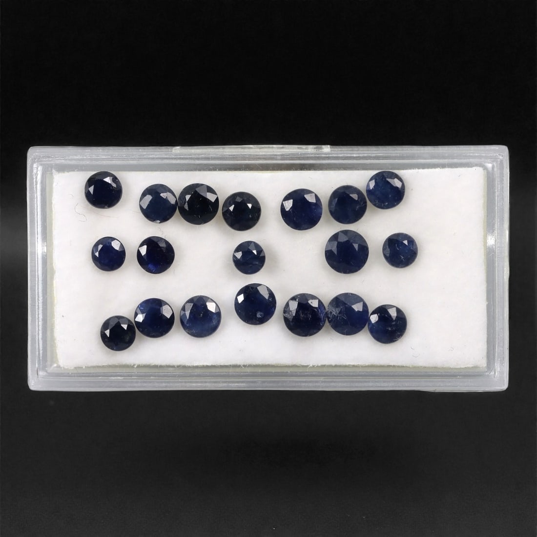 6.47 Carats Australian Blue Sapphire Parcel - Round Brilliant Cut, 65DA: This curated parcel of round brilliant-cut blue sapphires from Australia exhibits a rich, deep blue hue, reminiscent of the ocean at midnight. Each stone is precision-cut to maximize light return, cre