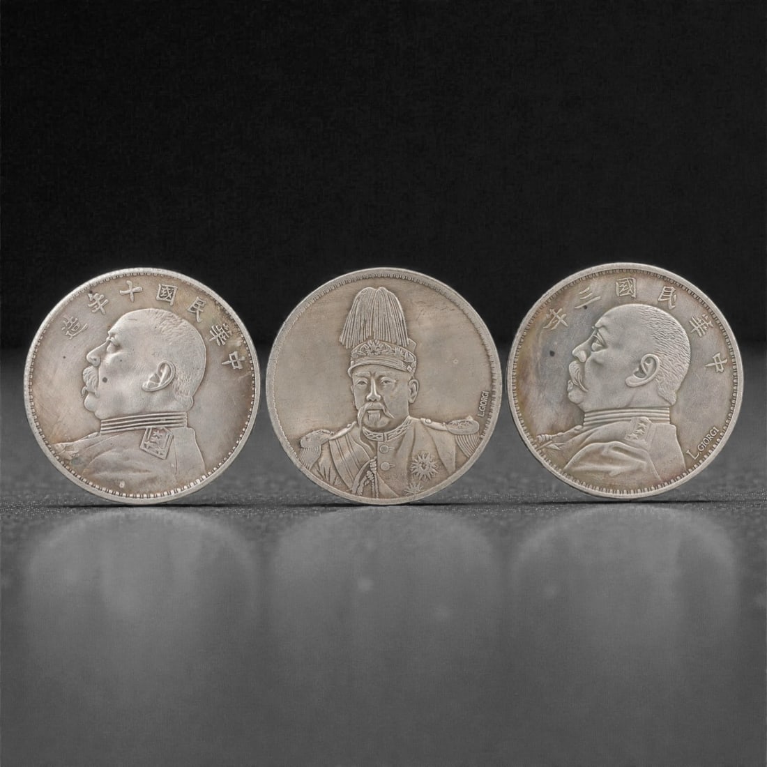 Three Chinese Commemorative Medallions Coins, 20th Century, 71FN: The group comprises three circular commemorative medallions, each with a diameter of 3.9 cm (1 1/2 in.). The first medallion depicts a bust portrait of a political figure in military uniform at its ce