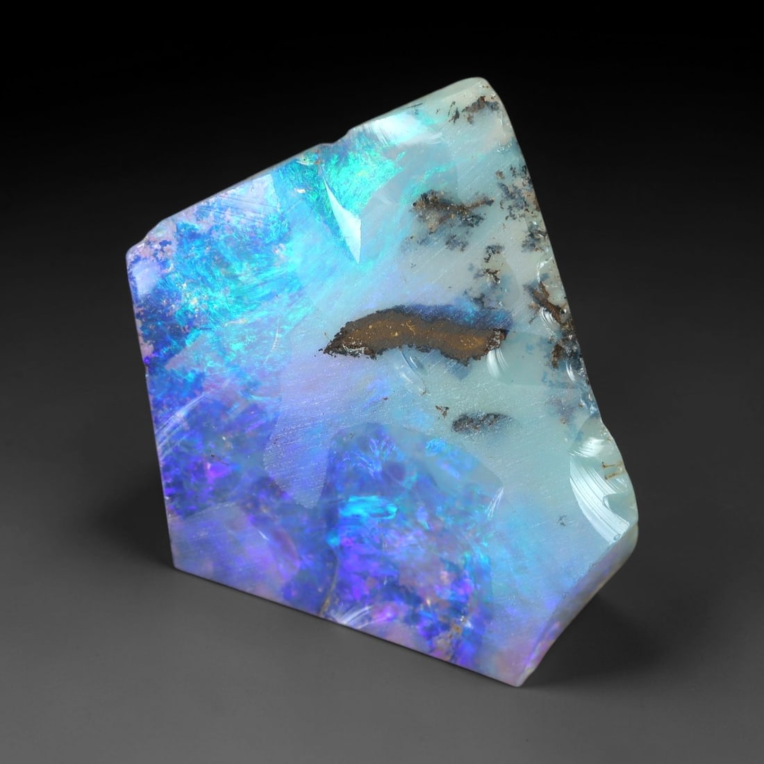 3.75ct Winton Boulder Opal Rough - Multicolored Play-of-Color Specimen, 29XM: This 3.75ct Winton boulder opal rough, measuring 17x14mm, is a striking example of Australia's iconic gemstone, showcasing the raw beauty of nature's artistry. The specimen features a milky white to p