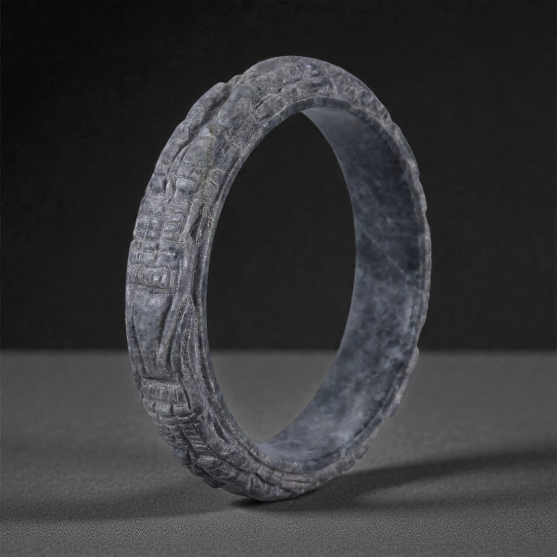 Jadeite Jade Dragon Bracelet - Carved Asian Bangle, 6.3cm Inner Diameter, 25WE, 25WE: Carved from dense grey-green jadeite, this bracelet is formed as a continuous circular bangle with sculptural relief carving along the exterior surface. The stone has been hollowed and shaped through