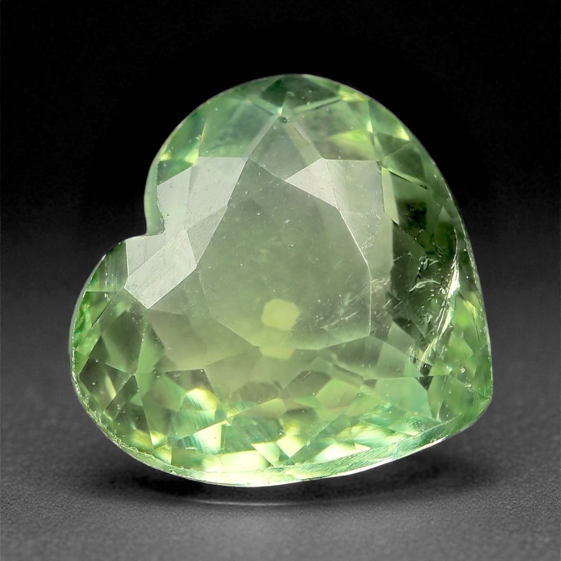 1.95 Carats Mint Green Tourmaline - Natural Afghan Stone - 8.3 x 7.7 x 4.3 mm, 43XK: This heart-shaped tourmaline glows with a fresh mint green hue, exuding lightness and elegance. Its soft pastel tone is beautifully complemented by well-executed faceting, creating a subtle inner glow